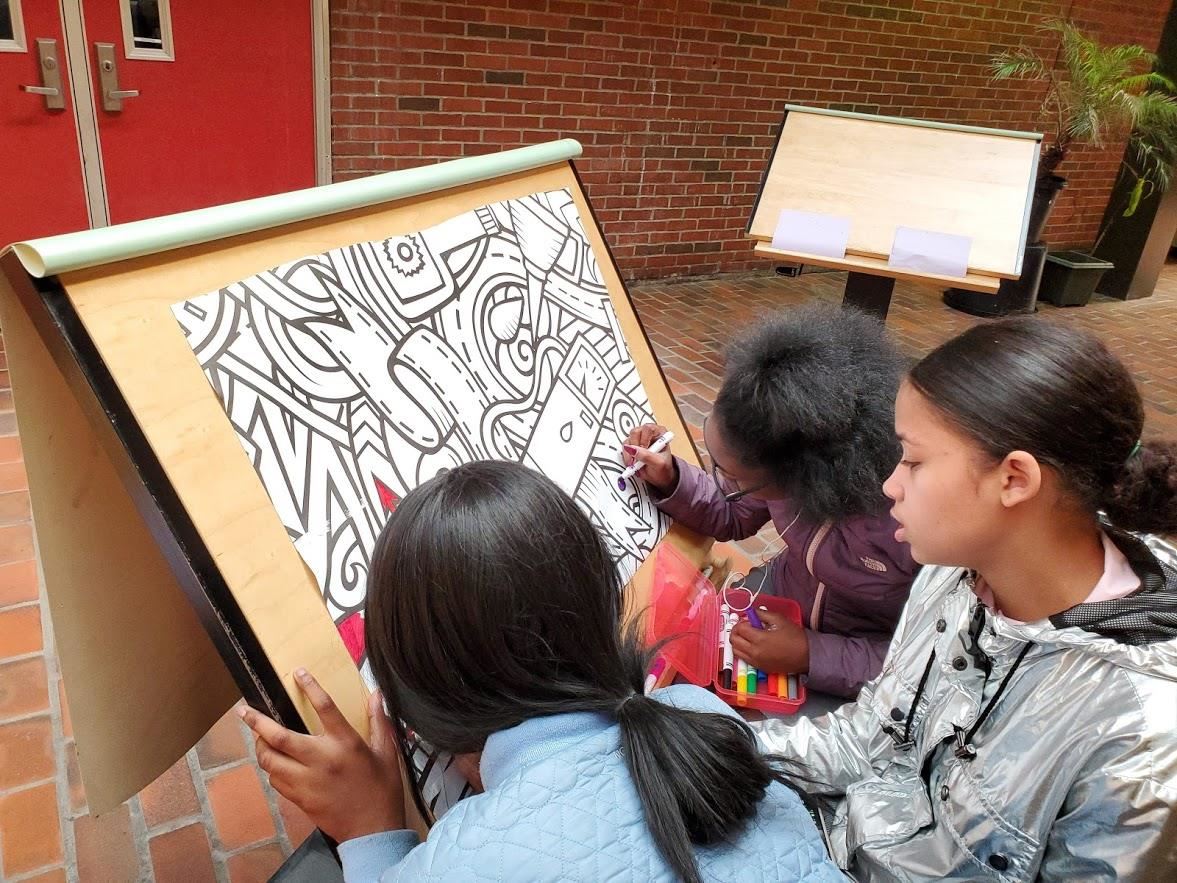 three girls coloring three girls coloring